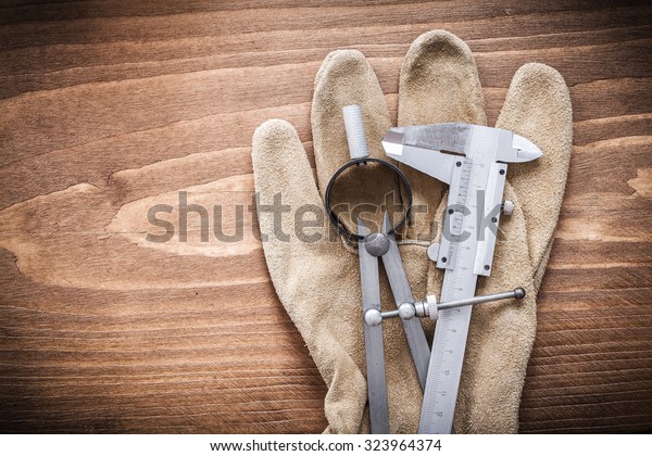 Vernier\
scale pair of compasses leather safety\
gloves.