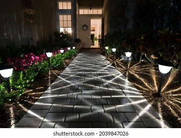 Vero Beach, Florida, USA - April 12, 2021:    Illuminated Walkway To Front Door At Nighttime