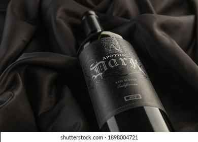 Vero Beach, Florida; USA; Dec. 7, 2020. A Close Up And Detailed Top Down View Of A Bottle Of Apothic Dark Red Wine. The Wine Bottle Is Photographed On A Wrinkled Silk Cloth Material Surface. 