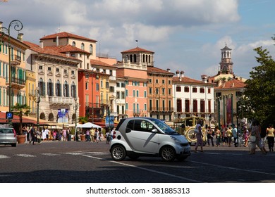 VERONA, ITALY - AUGUST 31, 2012: Small Car Smart On The Main Square In Verona - Piazza Bra, Where The World-famous Amphitheater Arena Di Verona. Currently It Is Concert Venue. Verona, Italy.