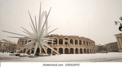 VERONA, ITALY - DEC 14, 2012: The Arena di Verona in winter with the comet while it snows (I-III century). UNESCO world heritage site. Veneto, Italy, Europe