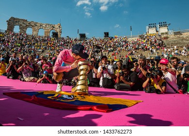 Verona, Italy June 2, 2019: Richard Carapaz, Movistar Team, In Pink Jersey Kiss The Infinite Trophy Having Won The General Classification Of The Giro D'Italia 2019.