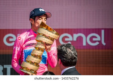 Verona, Italy June 2, 2019: Richard Carapaz, Movistar Team, In Pink Jersey Kiss The Infinite Trophy Having Won The General Classification Of The Giro D'Italia 2019.