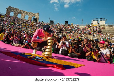 Verona, Italy June 2, 2019: Richard Carapaz, Movistar Team, In Pink Jersey Kiss The Infinite Trophy Having Won The General Classification Of The Giro D'Italia 2019.