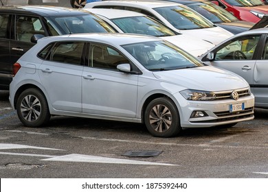 Verona, Italy - October 21, 2019: Modern cars parked on city street side in residential discrict. Shiny vehicles parked by the curb. Urban transportation infrastructure concept. - Shutterstock ID 1875392440