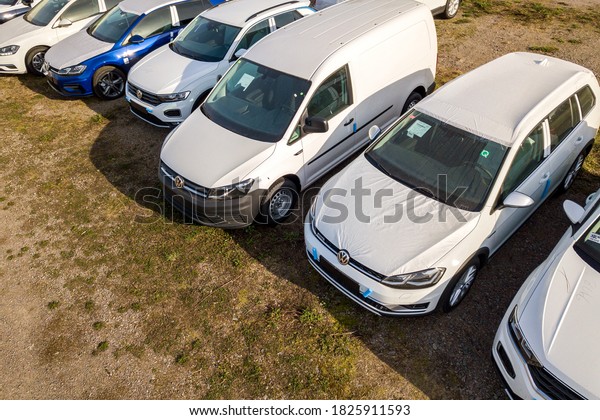 Verona, Italy - October 21, 2019: Many brand new
cars covered in protective foil on sale parked outside on dealer
parking lot.