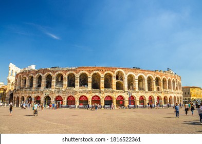 Verona, Italy, September 12, 2019: Verona Arena in Piazza Bra square. Roman amphitheatre Arena di Verona ancient building, sunny day, blue sky background, copy space, Verona city historical centre