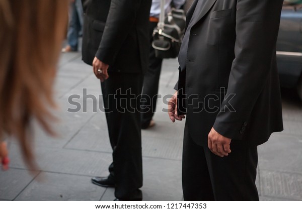 Verona, Veneto, Italy -\
05-22-2007 - Bodyguards waiting during a political election\
rally.\
They are in charge of security and safety of the politic\
Silvio Berlusconi.