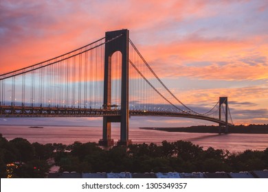 Verrazzano-Narrows Bridge In Brooklyn And Staten Island, NYC At Sunset With Colorful Sky