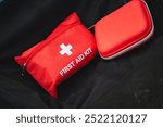 A versatile first aid kit essential for outdoor activities, featuring a red pouch and compact case for easy access to medical supplies