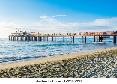 Versilia, Italy - Lido di Camaiore modern pier at sunset. Known for fashionable Riviera resorts, it consists of numerous clubs that are frequented by local celebrities.