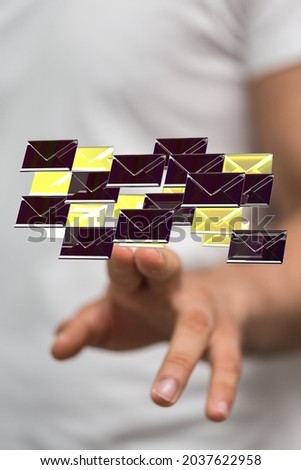 A vertical of 3D rendered golden mail icons in man's hands - Message, Online Chat concept