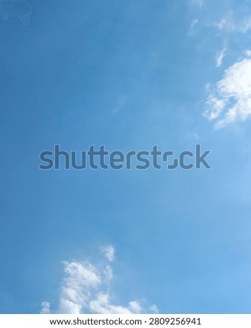 Vertical 4:5 composition of blue sky with soft white clouds and spacious copy space. Clean natural background ideal for posters, Pinterest and mobile graphics.