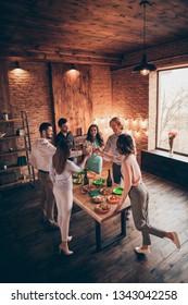 Vertical Above High Angle View Of Nice Attractive Lovely Slim Fit Thin Cheerful Positive Ladies Gentlemen Having Fun House Romantic Date Enjoy Snack In Wood Brick Industrial Loft Interior Room Indoors