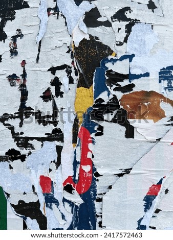 Vertical abstract street poster pattern of city wall placard layers torn off a wall