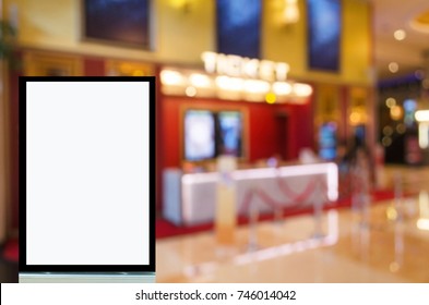 Vertical Advertising Billboard Or Blank Showcase Light Box For Your Text Message Or Media Content With Blurred Image Of Ticket Sales Counter At Movie Theater, Commercial And Marketing Concept