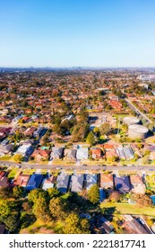 Vertical Aerial Panorama Over City Of Ryde Residential Suburbs In Western Sydney With A View Towards Distant City CBD.