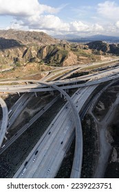 Vertical aerial view of the Golden State 5 and Antelope Valley 14 freeway interchange bridges near Newhall in Los Angeles County, California. - Shutterstock ID 2239223751