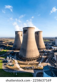 A vertical aerial view of a group of cooling towers at a coal fired power station - Shutterstock ID 2258637169