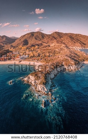 Vertical aerial view of rocks and cliffs in the Halkidiki region - Kalamitsi on the Sithonia peninsula. Visiting Greece and vacation concept