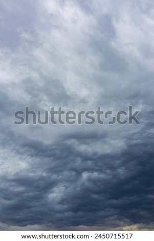 vertical background in the form of a cloudy gray sky. rain clouds. rain clouds. bad weather