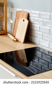 Vertical Background Image Of Minimal Kitchen Interior With Focus On Black Glass Stovetop, Copy Space