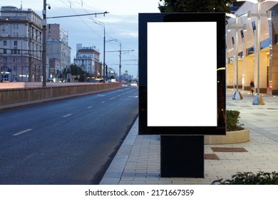 Vertical Billboard Advertising In The Night City. Road Is Blue From The Sky. Mock-up.