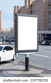 Vertical Billboard For Advertising And Text. Light Brick Building In The Background. Mock-up.