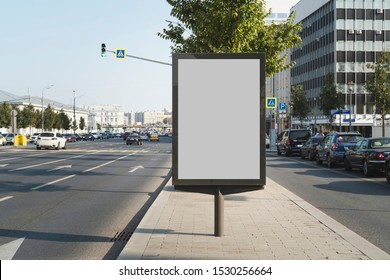 Vertical Billboard For Commercial Advertisements Standing By Busy Highway In City Center. Digital Solutions For Promotional Campaigns, Great Way To Draw Attention To Product And Service Ads Outdoors.