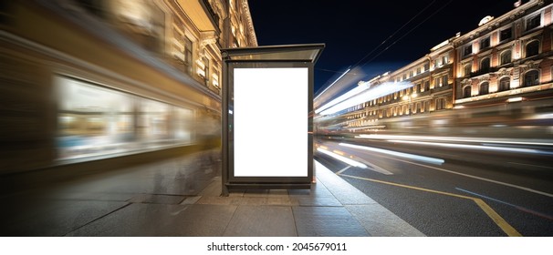 Vertical Billboard. In The Night City At The Bus Stop.