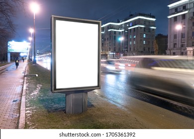 Vertical Billboard On The Edge Of The Road At Night