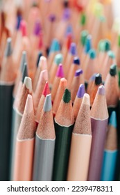 Vertical blur gradient image tightly packed crayons in stack  Colored tips close up  Vibrant artistic tools at an angle 