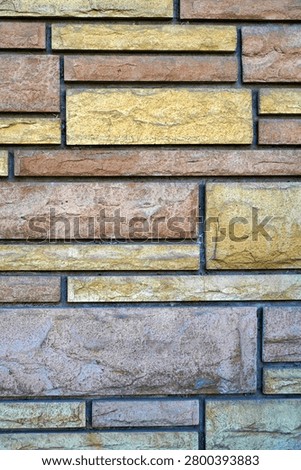 Vertical Brick wall with maze-like line pattern – abstract architectural design                              
