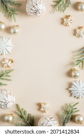 Vertical Christmas Banner Design. Boho Style Christmas Balls, Stars Decoration And Fir Branches On Beige Background. Flat Lay, Top View, Copy Space