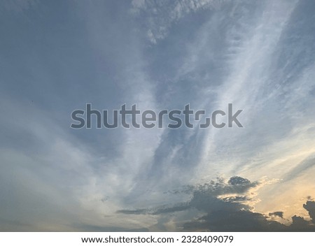 Vertical cirrus clouds dragon-like fantasies Appears in the sky in the evening at Bangkok, Thailand.no focus