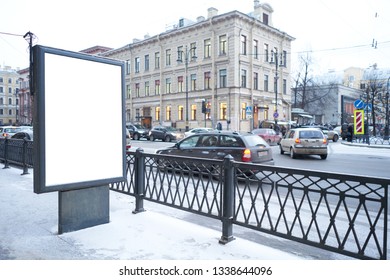 Vertical City Billboard With White Field MOCKUP. In The City Center In The Afternoon With Snow In The Winter Outdoor Advertising Ad.