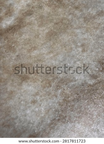 Vertical close up of beige marble texture background with natural stone patterns for interior design and architecture materials.