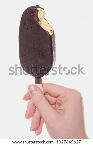 Vertical close up full-length full-size photo of tasty yummy delicious  with yellow banana pineapple vanilla flavor savor ice-cream in woman's hand isolated on white background