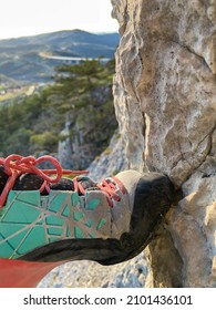 VERTICAL, CLOSE UP, DOF: Detailed Close Up Shot Of A Female Rock Climbing Shoe As A Climber Steps On A Tiny Stone Ledge. Unknown Woman's Climbing Shoe Gains Traction As She Steps On A Rocky Foothold.