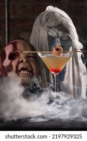 A Vertical Closeup Of A Cocktail Against Creepy Mannequins In Smoke