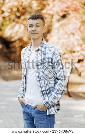 Similar – Image, Stock Photo Stylish teenager sitting on a wooden bench