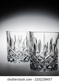 A Vertical Closeup Of Two Whiskey Glasses 