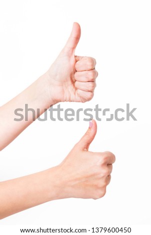 Vertical color photography of two female hands raising 2 thumbs up as sign of likeness or success. 