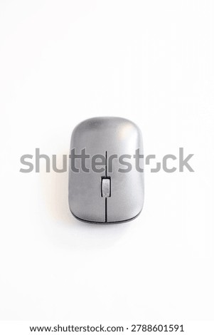 Vertical composition of a modern wireless computer mouse centred on a clean white background with ample negative space for design use.