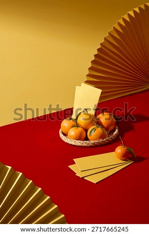 Vertical composition with red table and gold fan elements inspired by Lunar New Year traditions, decorated with tangerine and yellow lucky envelopes. Clean layout for product or text placement.