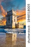 Vertical composition of sunset over Belem tower with reflection