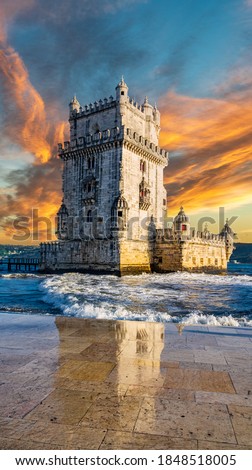 Vertical composition of sunset over Belem tower with reflection