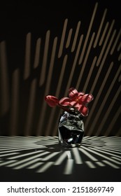 Vertical Contemporary Still Life Composition Of Fresh Pink Flower In Aluminum Beverage Can In Gobo Lighting