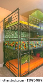 Vertical Cozy Room Interior With A Colorful Triple Bunk Bed For Children