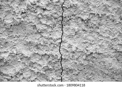 Vertical Crack In The Concrete Wall.Split In Two Halves.Abstract Background.